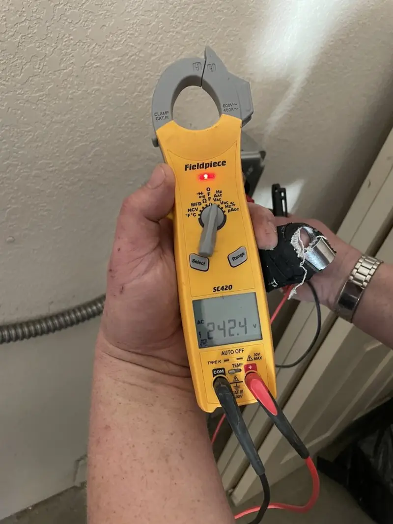 Voltage testing with clamp meter during Electrical Installation Services in Longwood